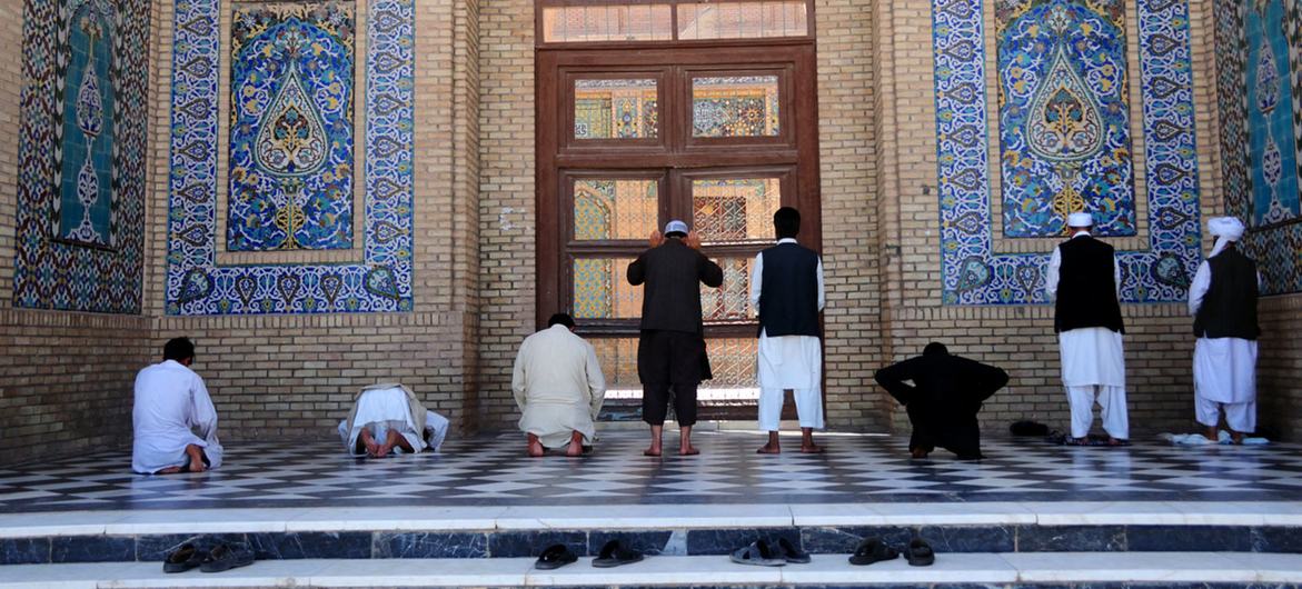Men pray at a mosque in Afghanistan.
